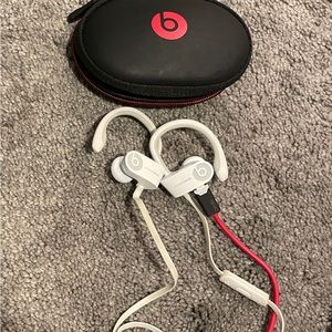 Beats by Dre, white headphones. Need to buy buds.